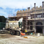 Limecrete Mixer which looks similar to a cement mixer parked outside redevelopment building